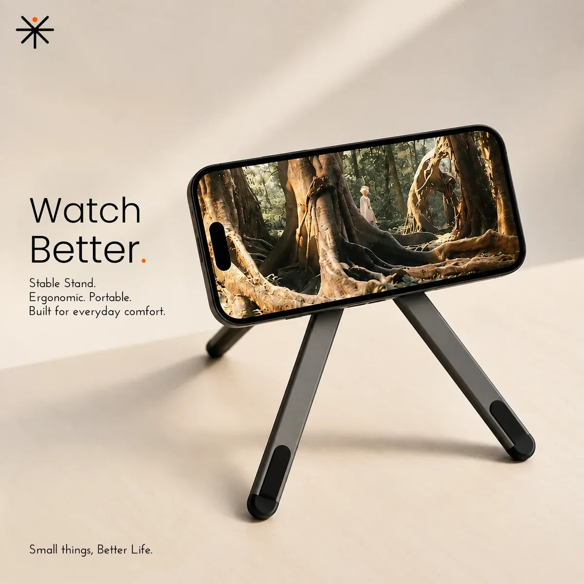 A black foldable phone stand holding a smartphone that displays a forest scene, set on a warm beige background with promotional text reading 'Watch Better.'.